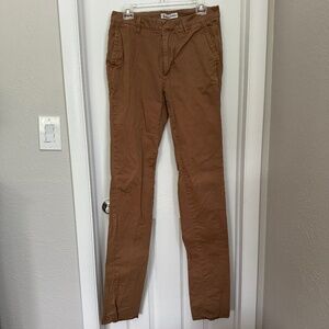 Men's Boden unhemmed khaki pants.
